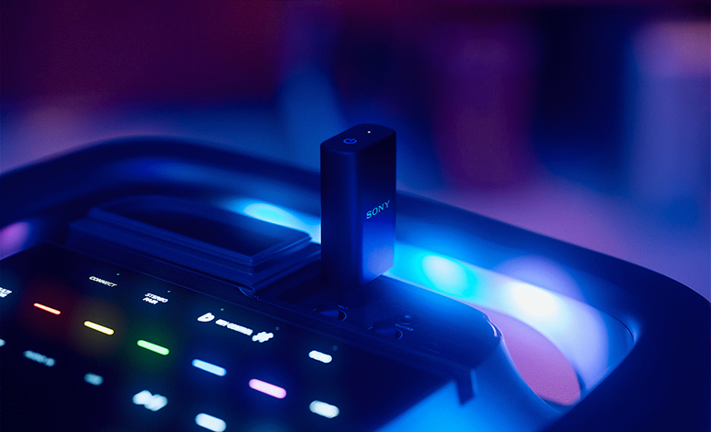 The top of the TOWER 9 speaker is visible with the plug and play receiver inserted into the top panel