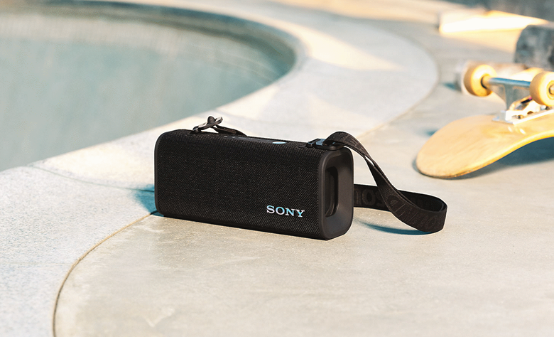 The ULT FIELD 3 speaker on the floor next to a skateboard