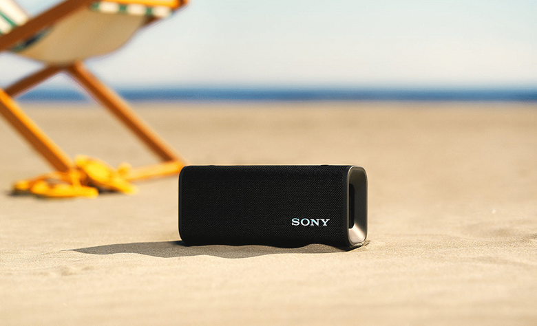 The ULT FIELD 3 speaker sitting on the sand on a beach