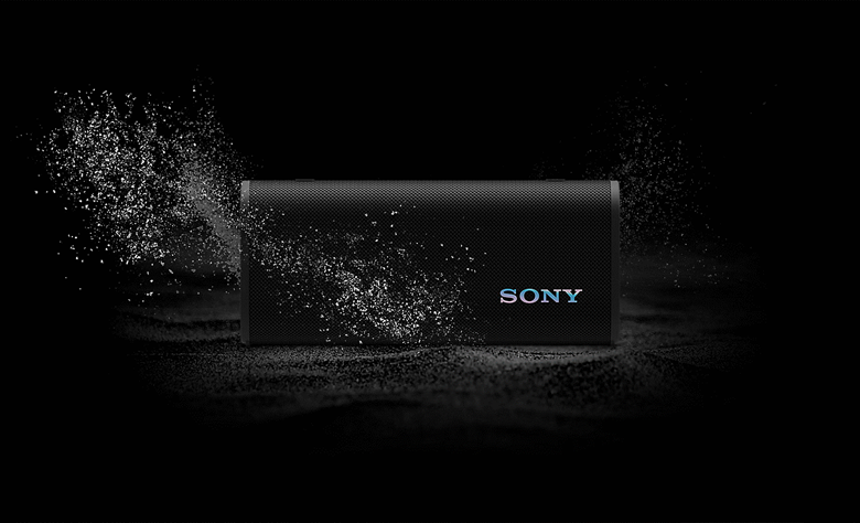 The ULT FIELD 3 is dropped in sand showing dust and water droplets falling on the product