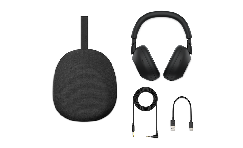Flat lay of WH-1000XM6 headphones, carrying case, headphone cable, and USB charging cable.